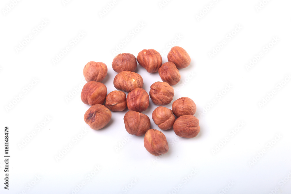 Hazelnuts isolated on white background. Selective focus. Hazelnuts isolated on white background. Selective focus.