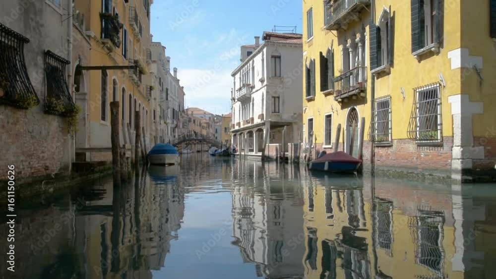 Romantic tour in gondola, rowed by a gondolier in the venice canal.