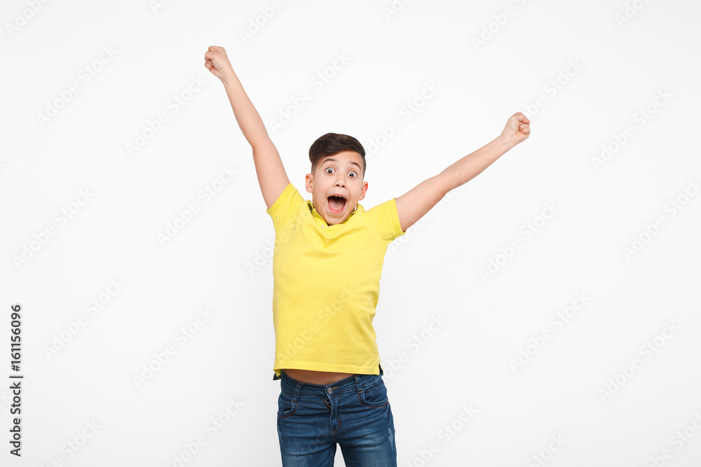 Excite boy posing with hands up