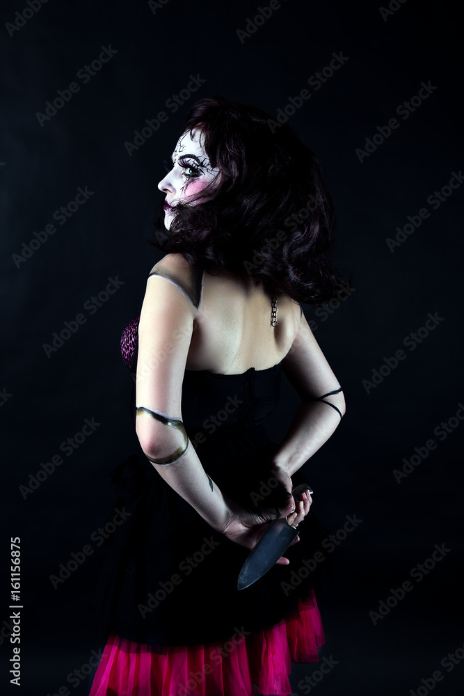 model with makeup scary doll with knife model with makeup scary doll with knife