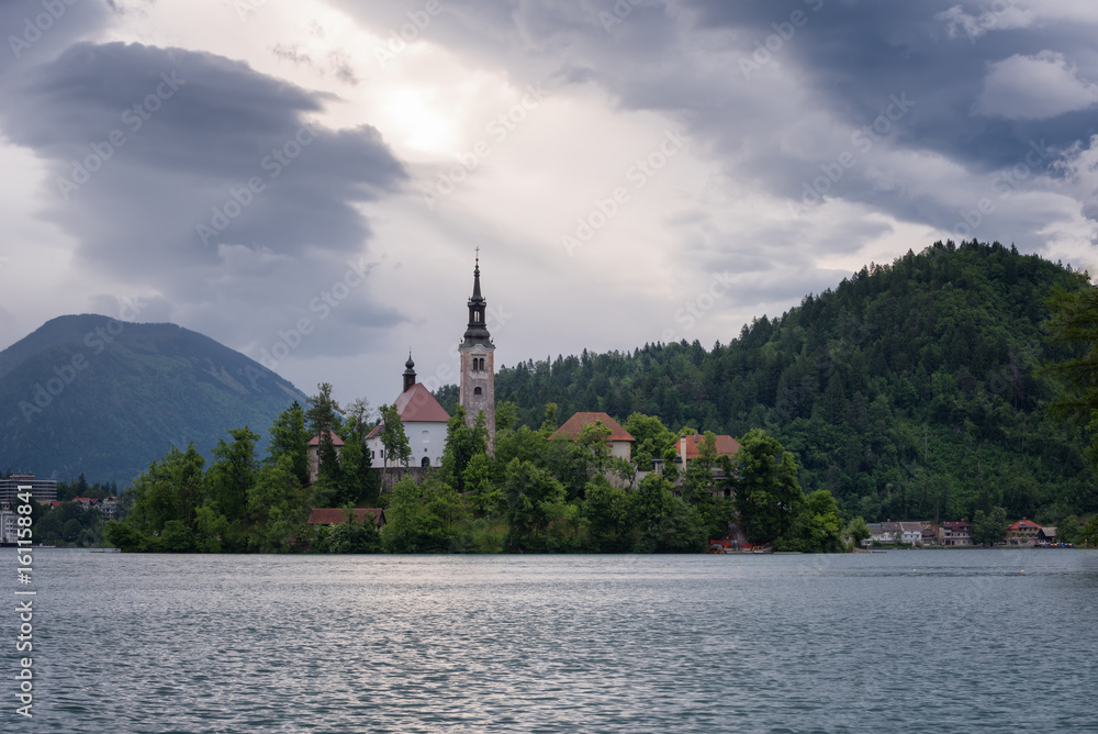 Amazing spring sunrise on Bled lake, Island, Church And Castle with Mountain Range (Stol, Vrtaca, Begunjscica) In The Background - Bled, Slovenia, Europe Amazing spring sunrise on Bled lake, Island, Church And Castle with Mountain Range (Stol, Vrtaca, Begunjscica) In The Background - Bled, Slovenia, Europe