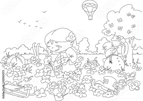 Girl taking flowers in the field funny picture