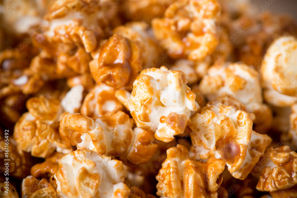 Caramel opcorn in bowl on the wooden table. Caramel opcorn in bowl on the wooden table.