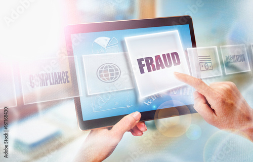 Canvas Print A businesswoman selecting a Fraud business concept on a futuristic portable computer screen