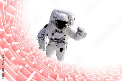 Fototapeta Naklejka Na Ścianę i Meble -  astronaut over huge endless maze structure 