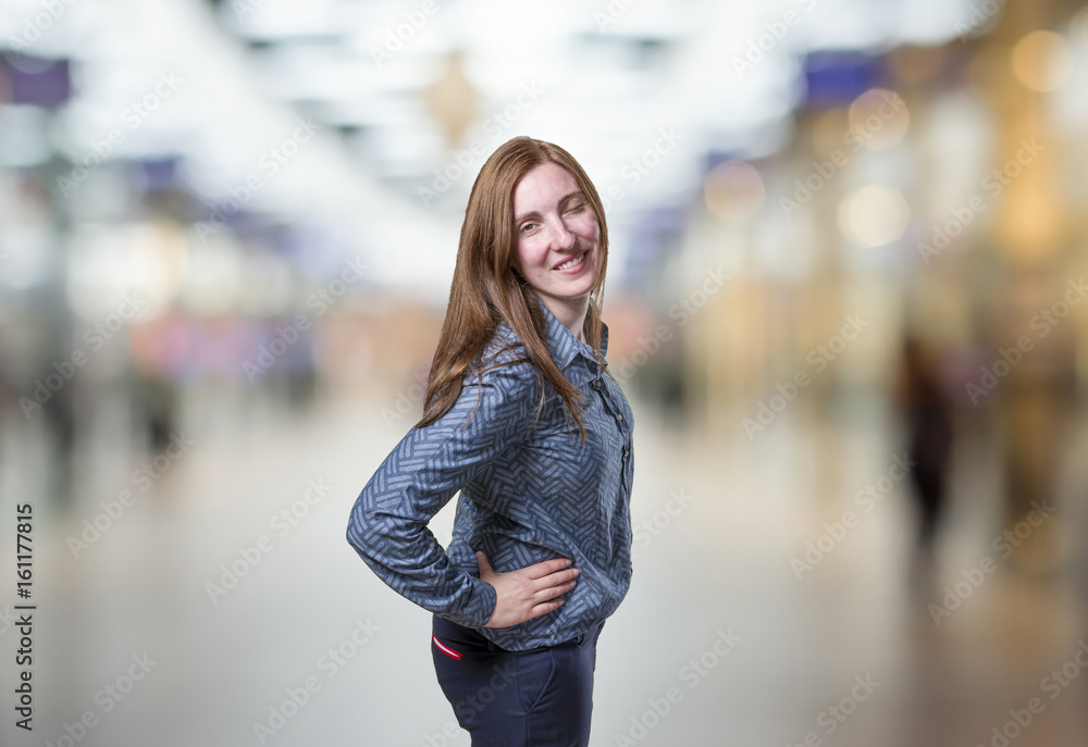 Pretty business woman doing a wink eye over blur background Pretty business woman doing a wink eye over blur background