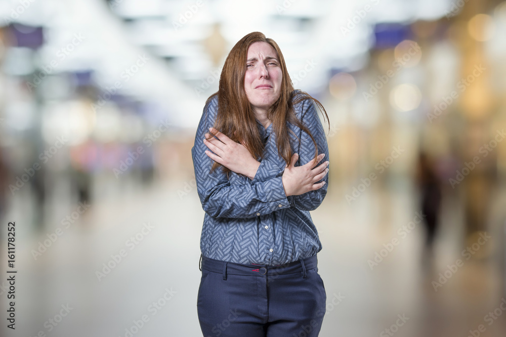 Pretty business woman freezing over blur background