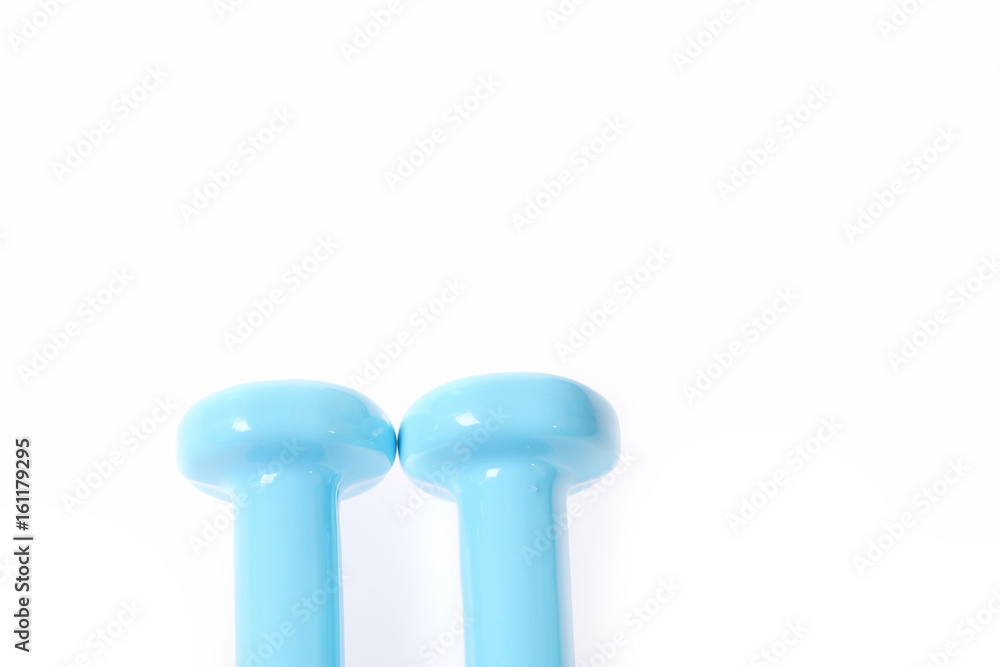 Pair of barbells in cyan colour lying near each other Pair of barbells in cyan colour lying near each other