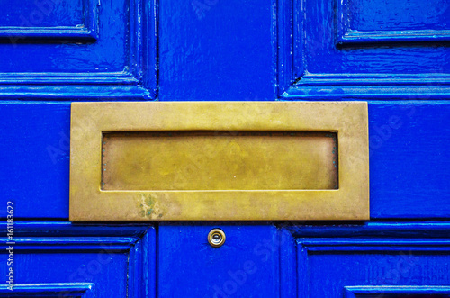 Old letterbox in the door, traditional way of delivering letters to the house, old mailbox © Q77photo