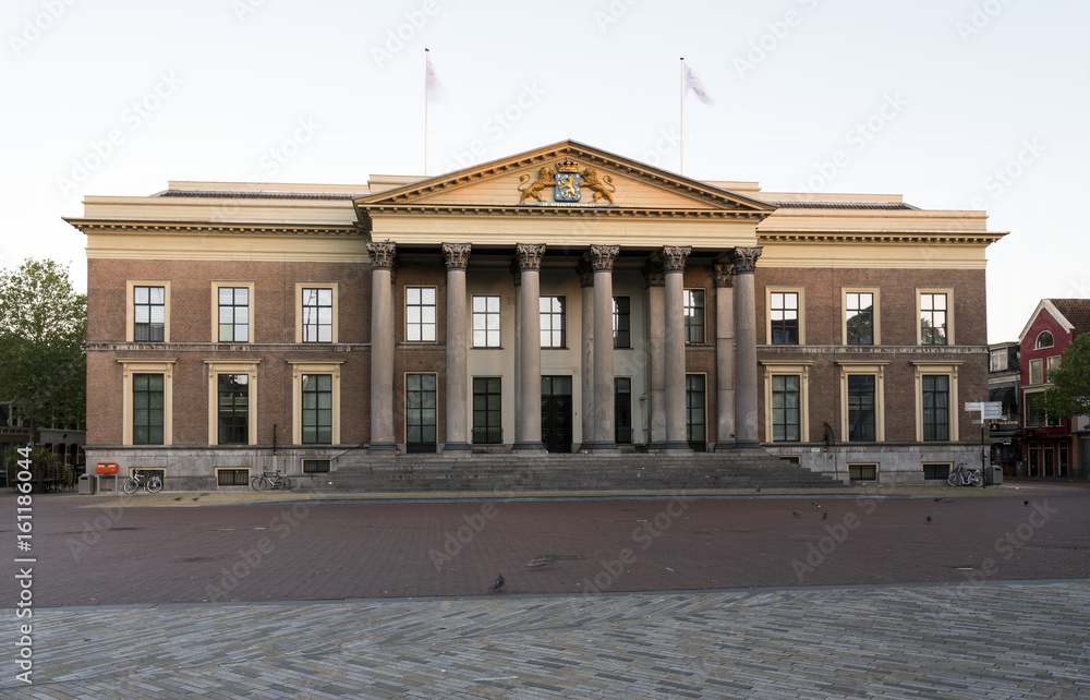 Naklejka premium courthouse in leeuwarden, capital of the dutch province of Friesland in warm morning light