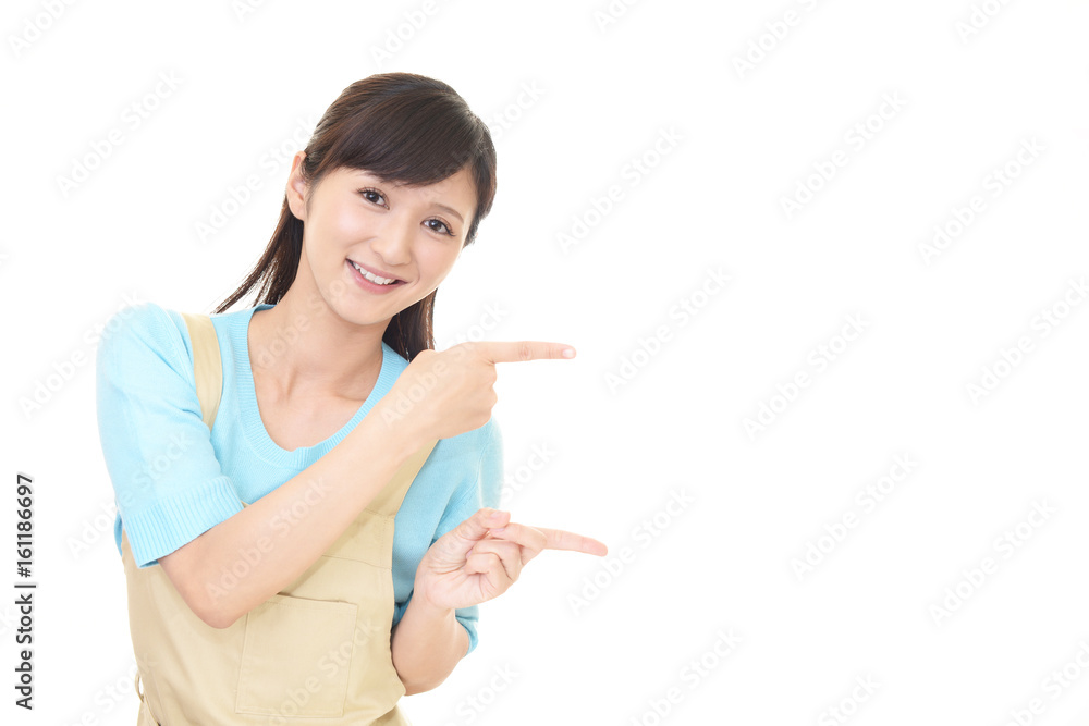 指示する笑顔の主婦 指示する笑顔の主婦