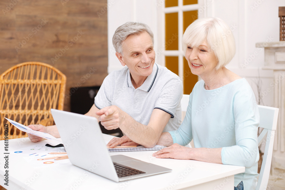 Sincere productive lady sharing her work with her husband Sincere productive lady sharing her work with her husband