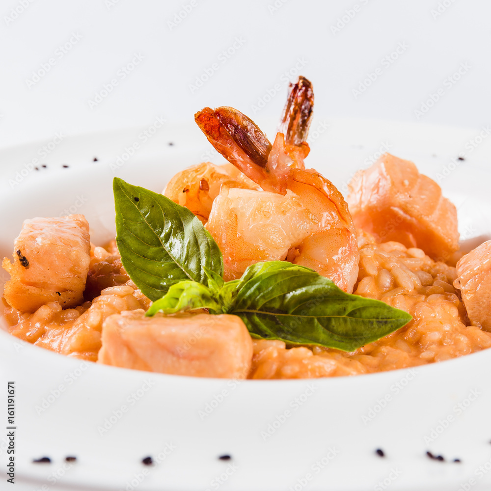 Risotto with shrimp and salmon in a mild creamy sauce (close) Risotto with shrimp and salmon in a mild creamy sauce (close)