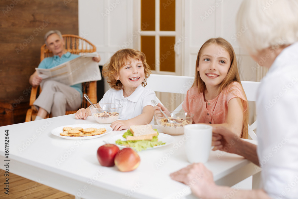 Positive sincere cute family gathering for breakfast Positive sincere cute family gathering for breakfast