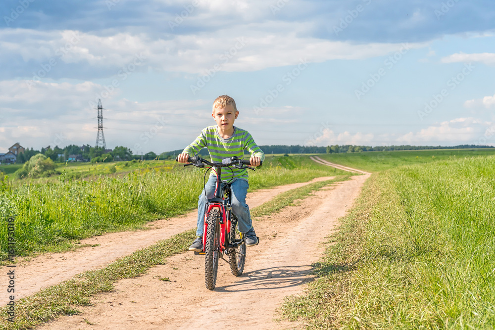 Naklejka premium child on a bicycle