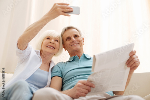 Sweet romantic elderly couple taking a selfie