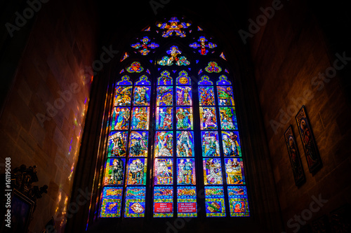 Beautiful stained glass window inside the St. Vitus Cathedral, Prague, Czech Republic