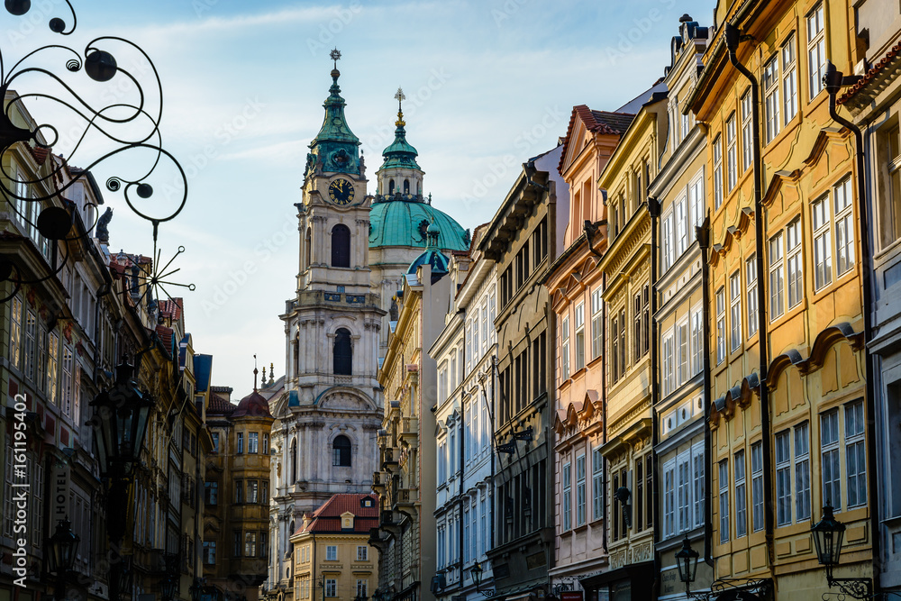 View of traditional buildings in Prague with St. Nicholas Church in background