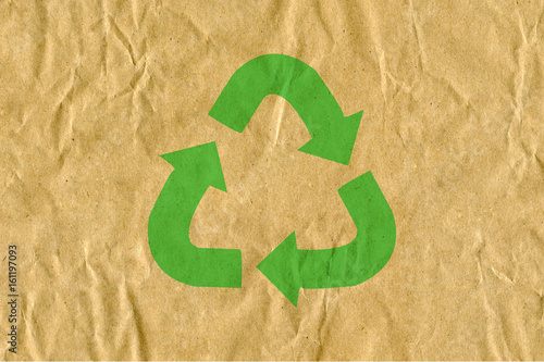 symbol for refuse reuse recycle with cardboard background photo