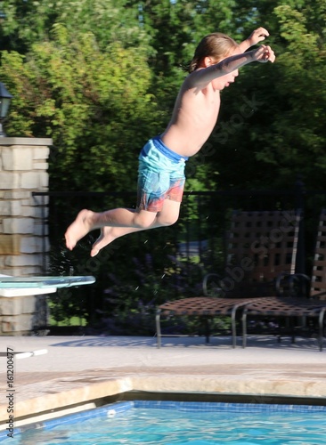 Boy on diving board