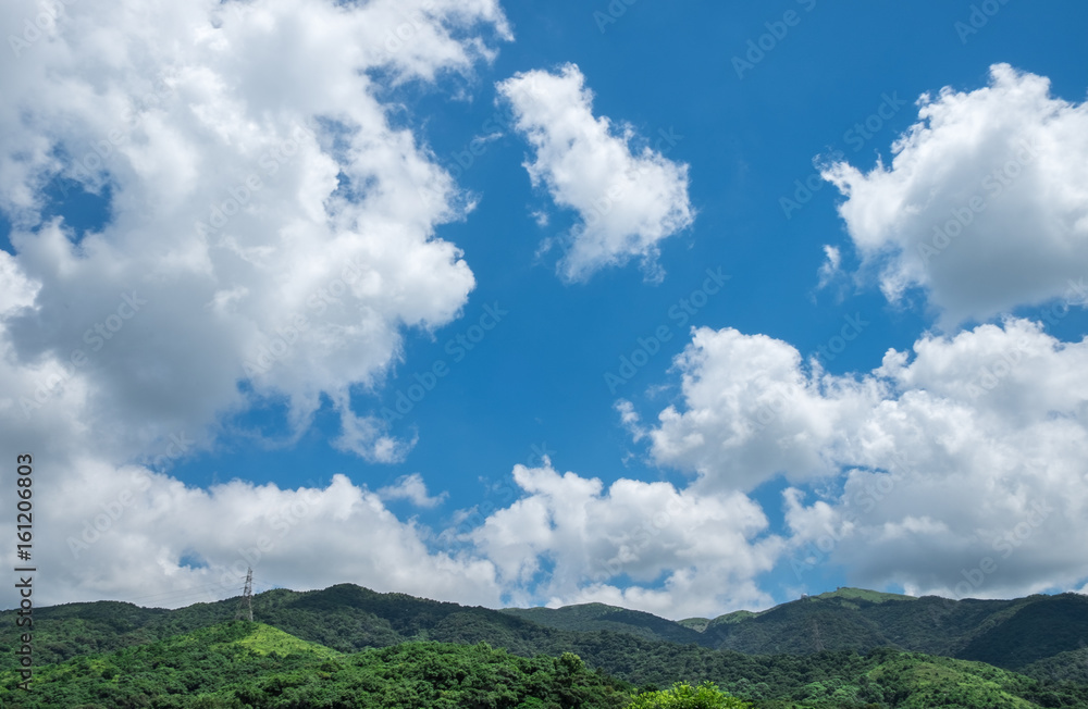 Altocumulus Clouds in Deep Blue Sky Above the Mountain. Altocumulus Clouds in Deep Blue Sky Above the Mountain.