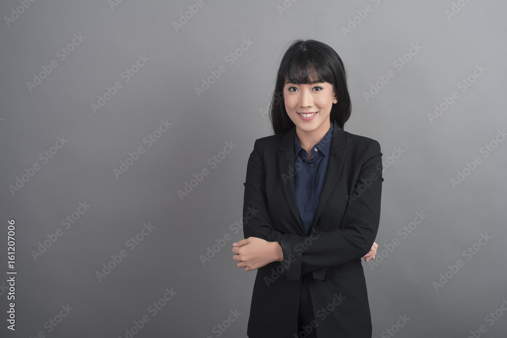 Beautiful Business Woman confident on grey background Beautiful Business Woman confident on grey background