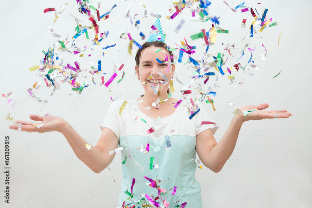 happy woman at celebration party with confetti falling everywhere on her. Birthday or New Year eve celebrating concept
happy woman at celebration party with confetti falling everywhere on her. Birthday or New Year eve celebrating concept