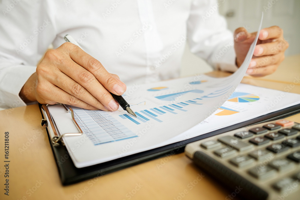 Business concept. Business people discussing the charts and graphs showing the results of their successful teamwork. Business concept. Business people discussing the charts and graphs showing the results of their successful teamwork.