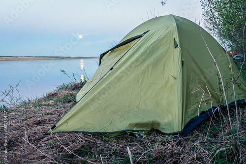 Tourist tent on the river bank © Михаил Сидоров