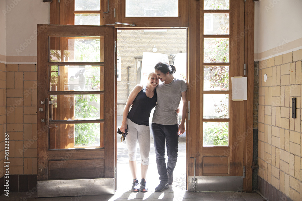 Couple standing in doorway Couple standing in doorway