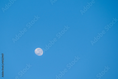 The moon on blue sky