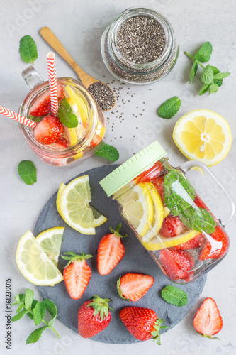 Healthy detox chia seed drink with strawberry  lemon and mint in glass jar  vertical  top view
