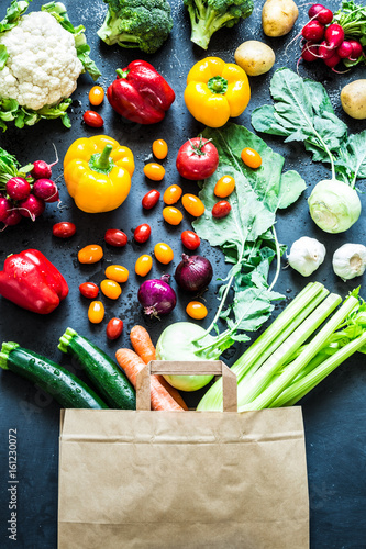 Fototapeta Naklejka Na Ścianę i Meble -  Colorful organic vegetables in paper eco shopping bag