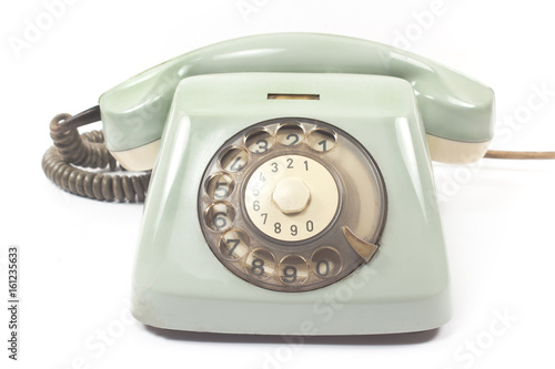 Old telephone isolated on white background