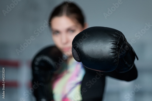 Young adult sexy boxing girl posing with gloves. © Viktor Koldunov