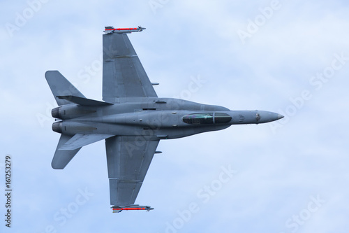 Jet fighter flying low.