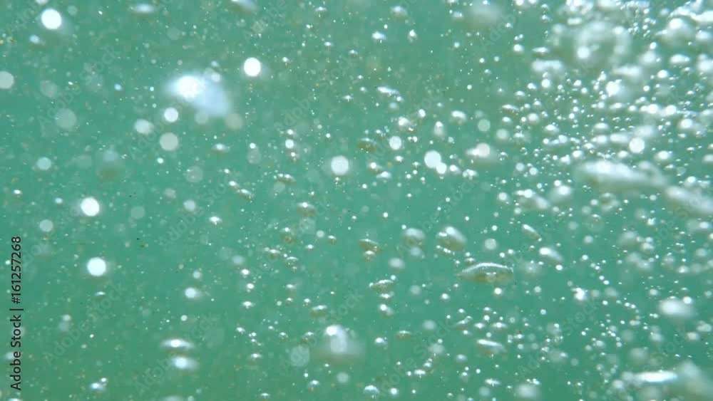 Bubbles rising to the surface. Air bubbles in water in sea (underwater shot), good for backgrounds. Slow motion.
Bubbles rising to the surface. Air bubbles in water in sea (underwater shot), good for backgrounds. Slow motion.