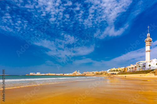 Playa de la Santamaria beach and Cathedral de Santa Cruz in the morning in Cadiz, Andalusia, Spain