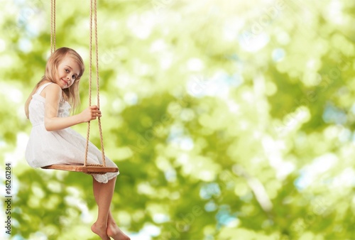 Child on swing.