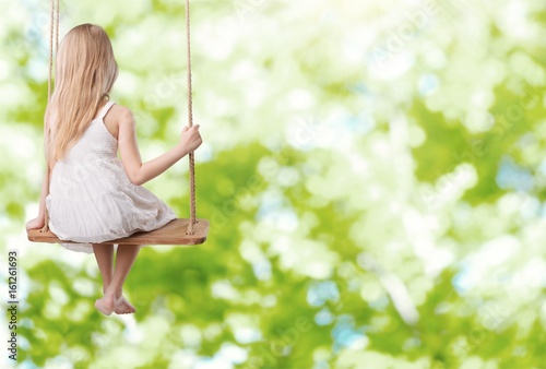 Child on swing.