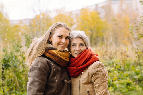  Happy mother and daughter portrait. Portrait of beautiful mature mother and her daughter . 