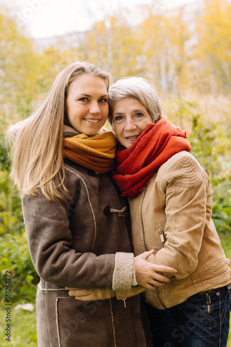  Happy mother and daughter portrait. Portrait of beautiful mature mother and her daughter . 