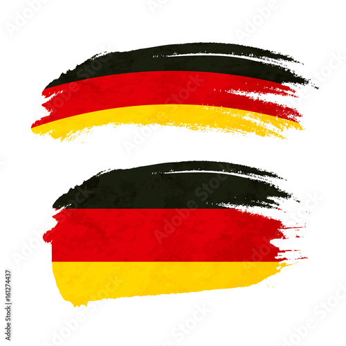 Grunge brush stroke with Germany national flag on white