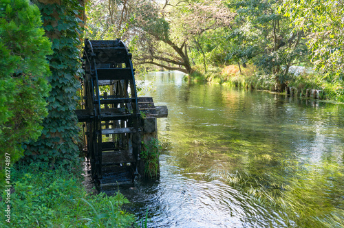 Water mill wheel on river