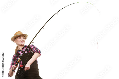 Happy woman in sun hat holding fishing rod photo