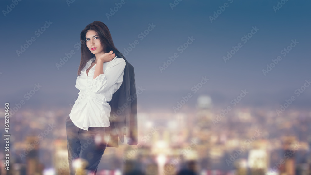 Woman looking at night city