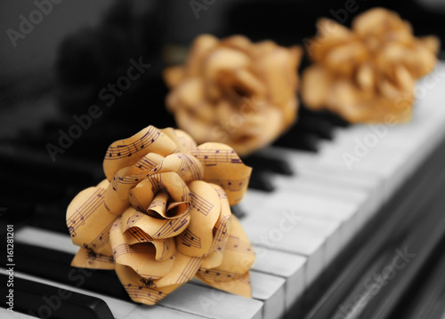 Rose made of music notes on piano keys