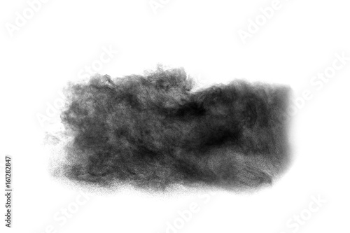 Abstract black powder splatted on white background,Freeze motion of black powder exploding.