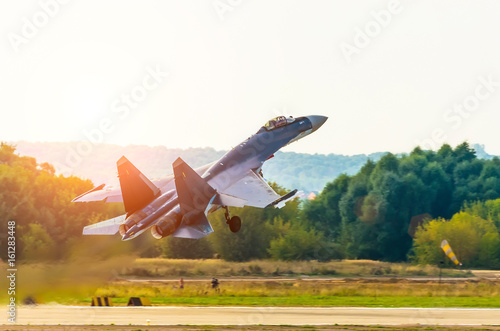 Bild auf Leinwand Fighter take off with a military military airfield.