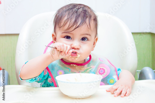 baby eating spoon